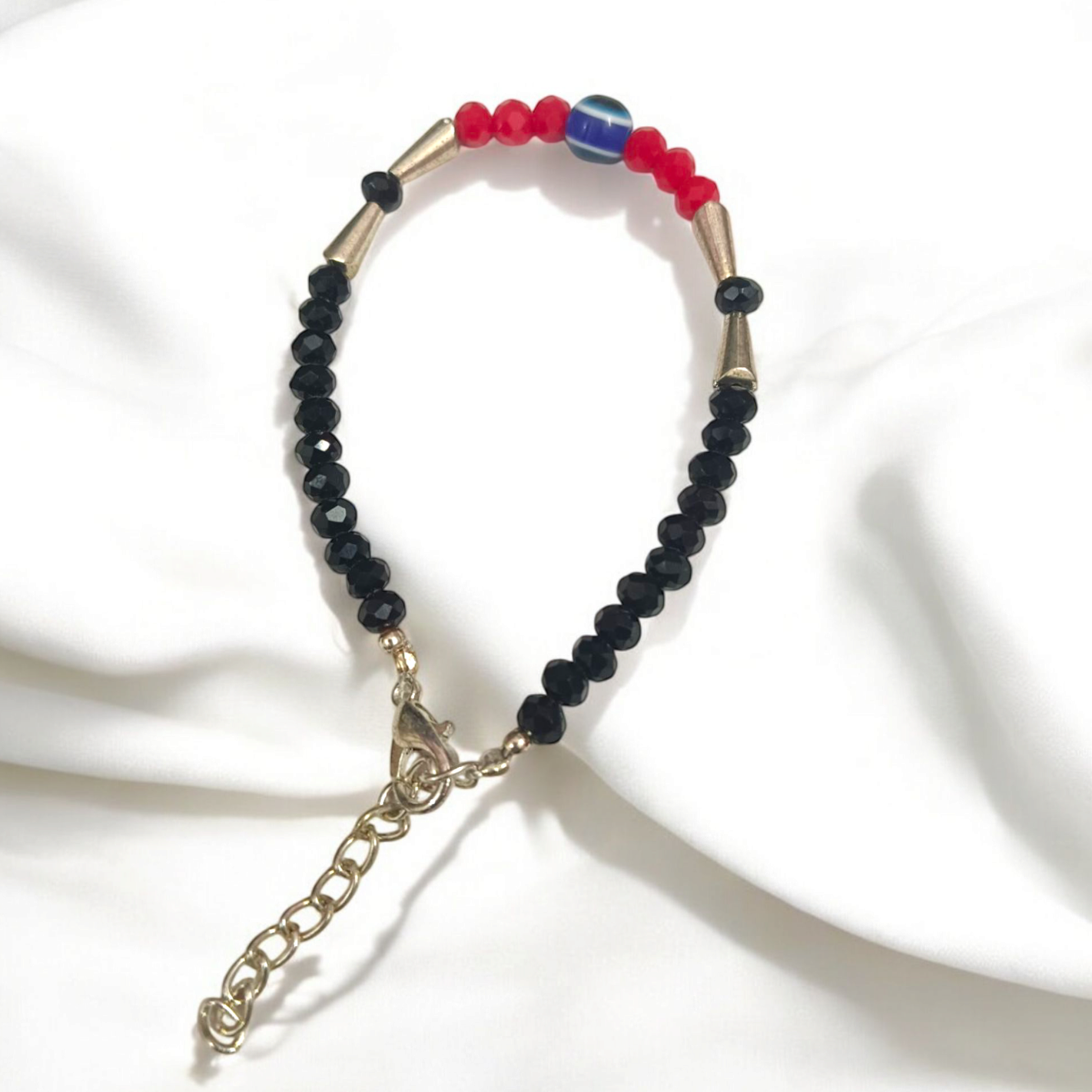 Evil Eye Anklet for Kids with black and red beads, designed for spiritual protection and good luck.