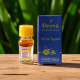 Glass bottle of Raat Rani Attar (1ML) by Veena, natural floral perfume for spiritual and worship use, displayed on a soft background with jasmine flowers