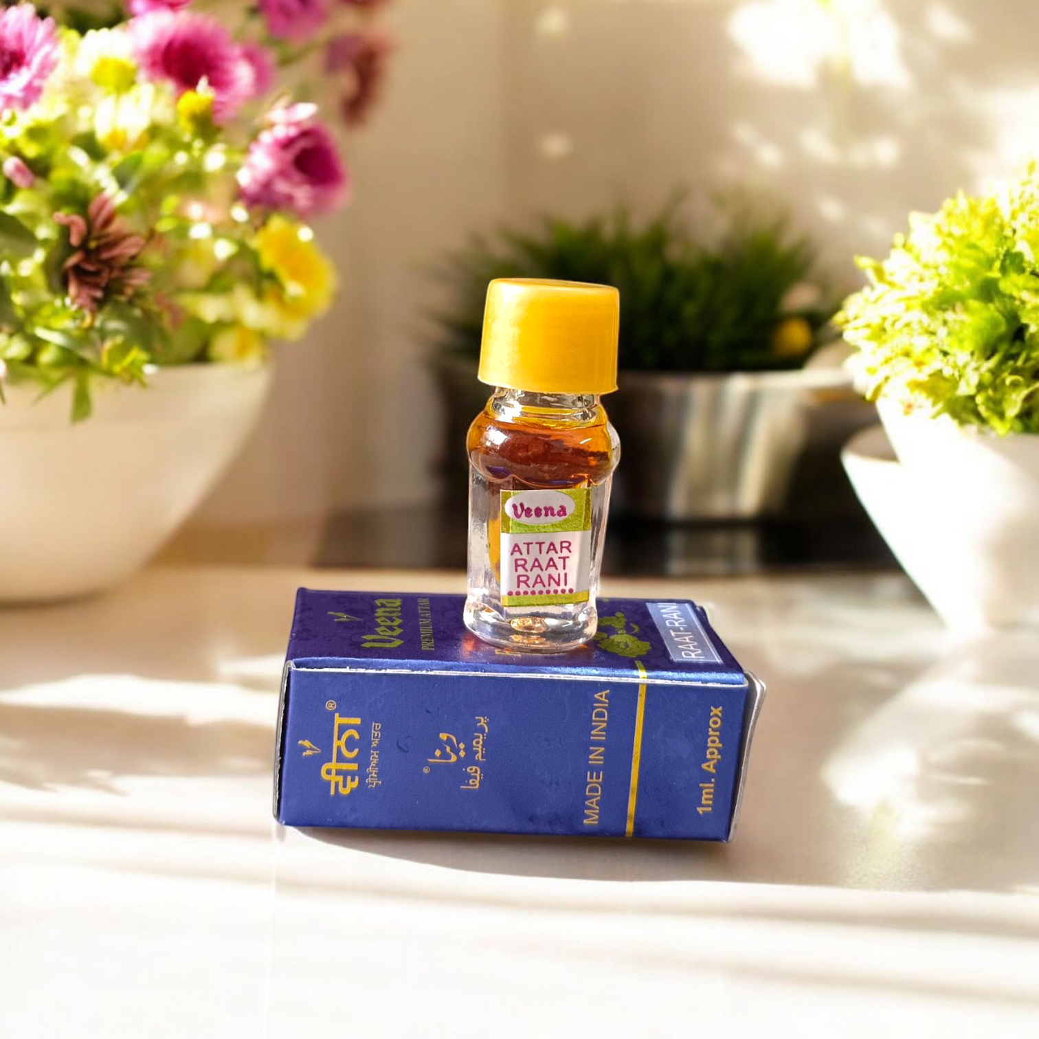 Glass bottle of Raat Rani Attar (1ML) by Veena, natural floral perfume for spiritual and worship use, displayed on a soft background with jasmine flowers