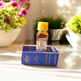 Glass bottle of Raat Rani Attar (1ML) by Veena, natural floral perfume for spiritual and worship use, displayed on a soft background with jasmine flowers