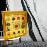 Gold-plated Sampoorna Baglamukhi Yantra with intricate details in a wooden frame, offering protection, prosperity, and divine blessings