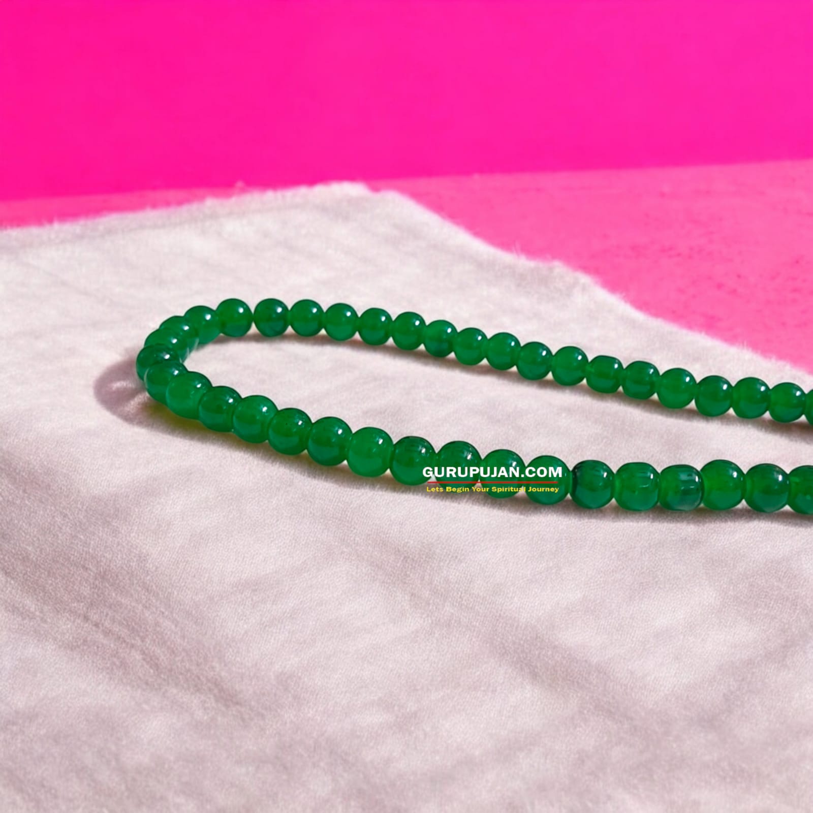 Green Agate Mala with 108 beads displayed on a spiritual setup, showcasing natural green hues and smooth polished finish