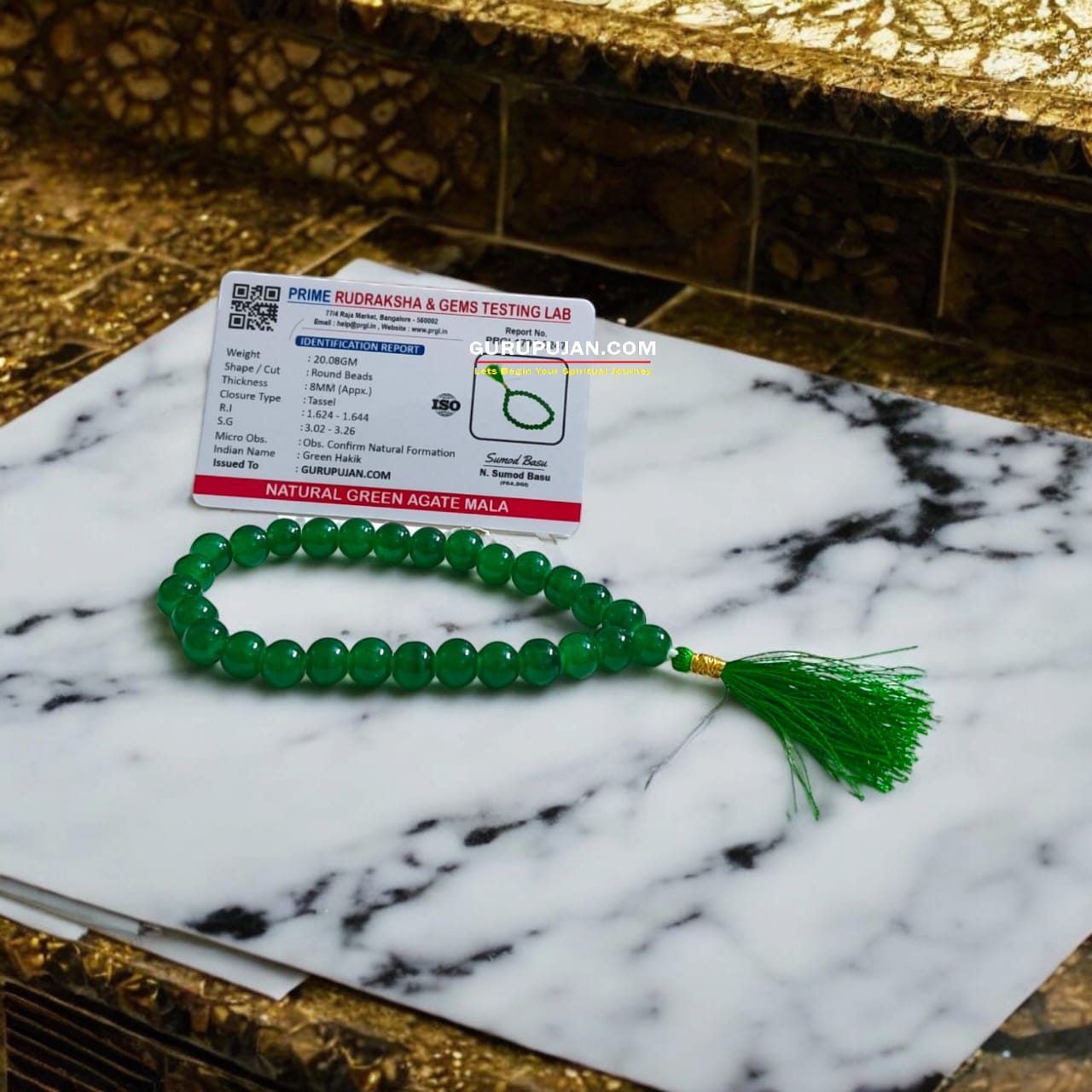 Green Agate Mala with 108 beads displayed on a spiritual setup, showcasing natural green hues and smooth polished finish
