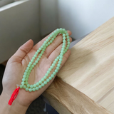 Green Moti Mala with 108+1 beads for meditation, emotional healing, and spiritual practice