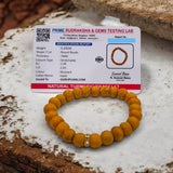 Haldi Bracelet made of 8MM natural turmeric beads, stretchable design, and certificate of authenticity for spiritual and healing benefits.
