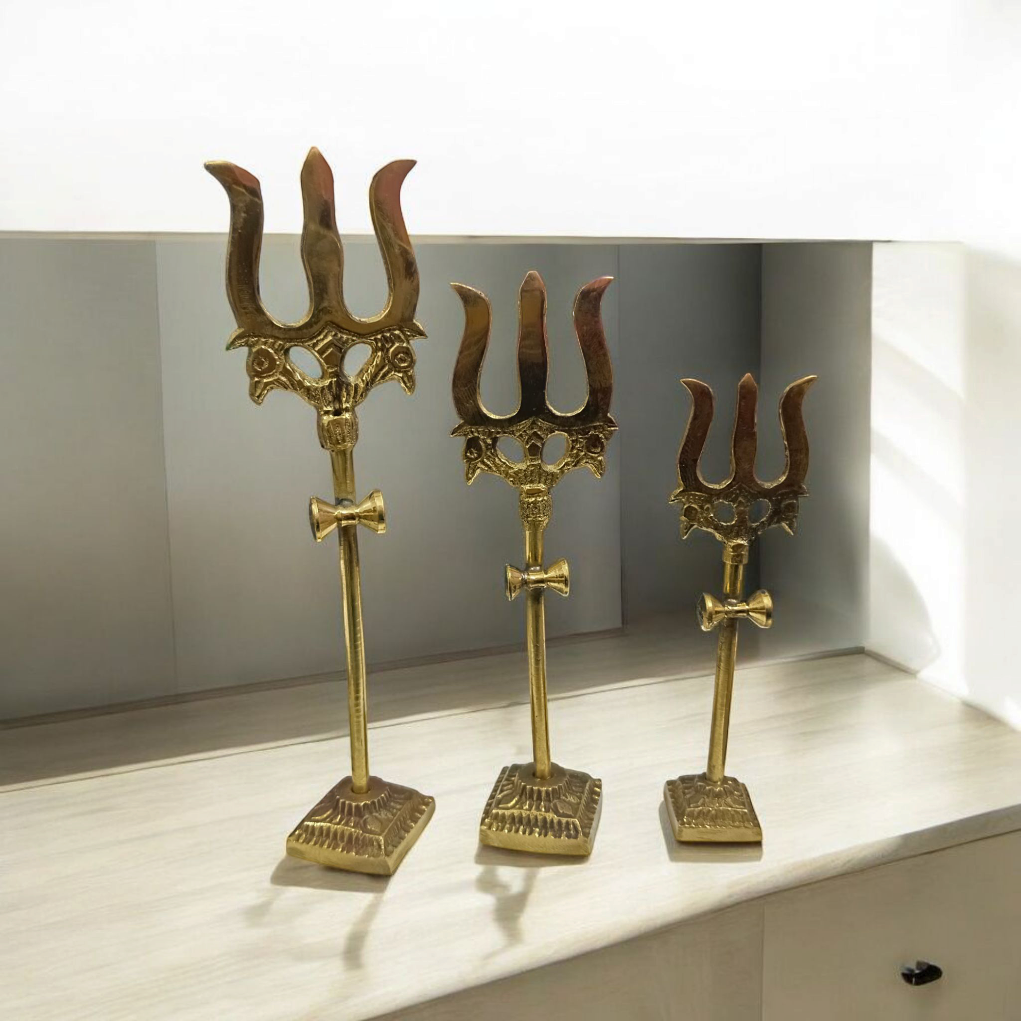 Handcrafted Brass Trishul with Damru figurine, a symbol of Lord Shiva’s power and protection, perfect for pooja rituals and home decor.

