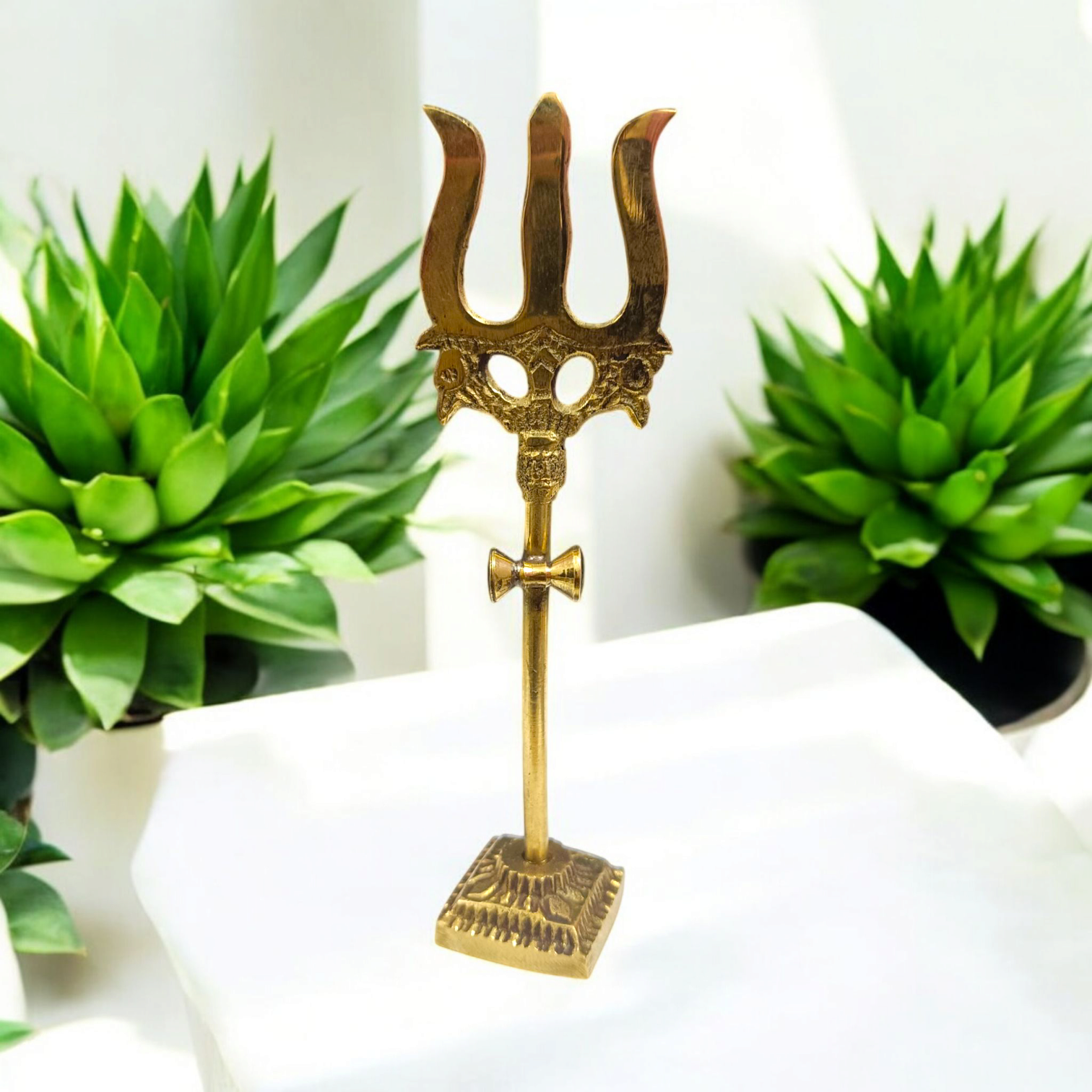 Handcrafted Brass Trishul with Damru figurine, a symbol of Lord Shiva’s power and protection, perfect for pooja rituals and home decor.

