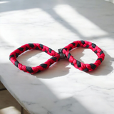 Handmade red and black cotton bracelet threads for men and women, symbolizing protection and style, set of 2 by Gurupujan