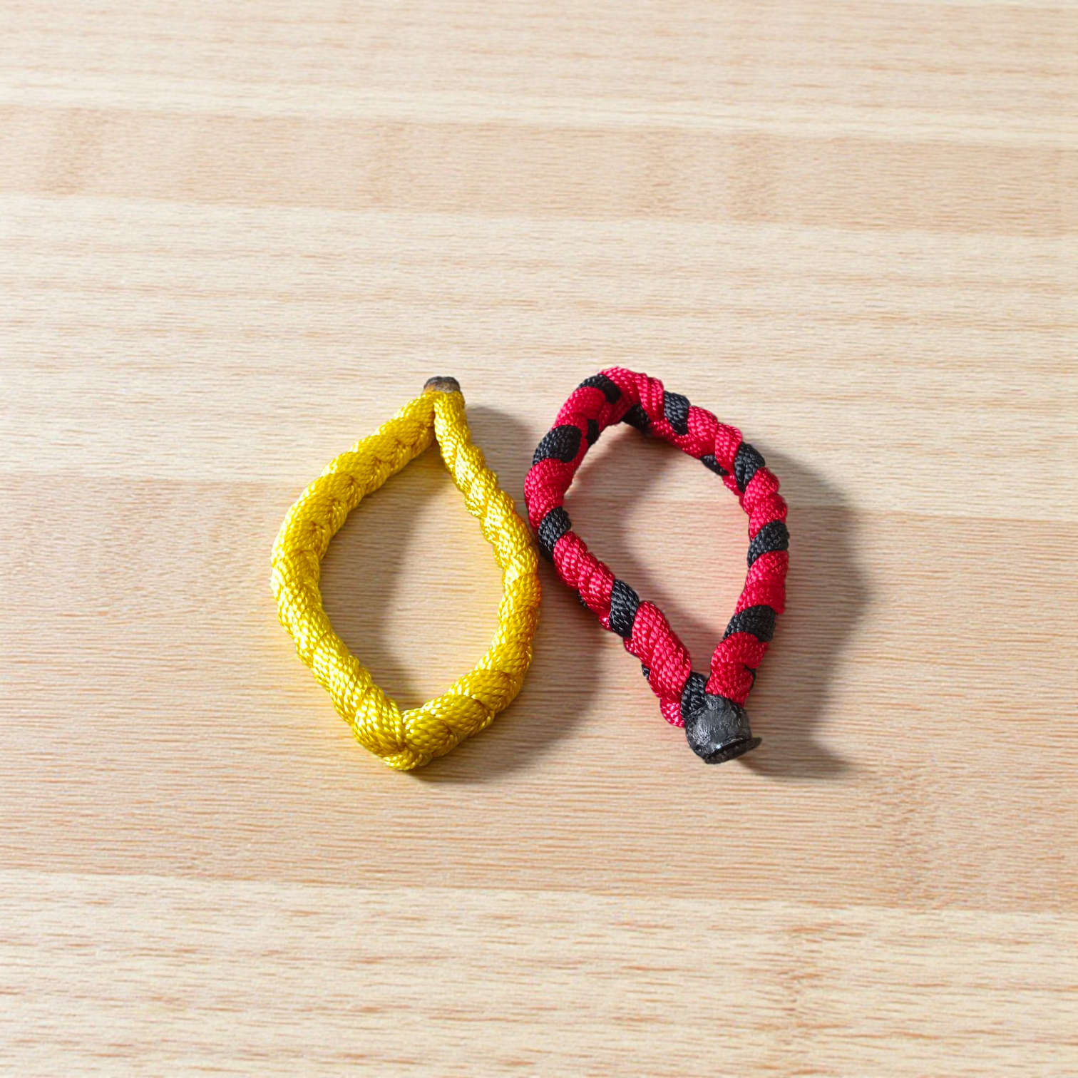 Handmade thread bracelet set of 4 in red, yellow, black, and multicolor for men and women, symbol of protection and spirituality by Gurupujan