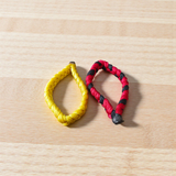 Handmade thread bracelet set of 4 in red, yellow, black, and multicolor for men and women, symbol of protection and spirituality by Gurupujan