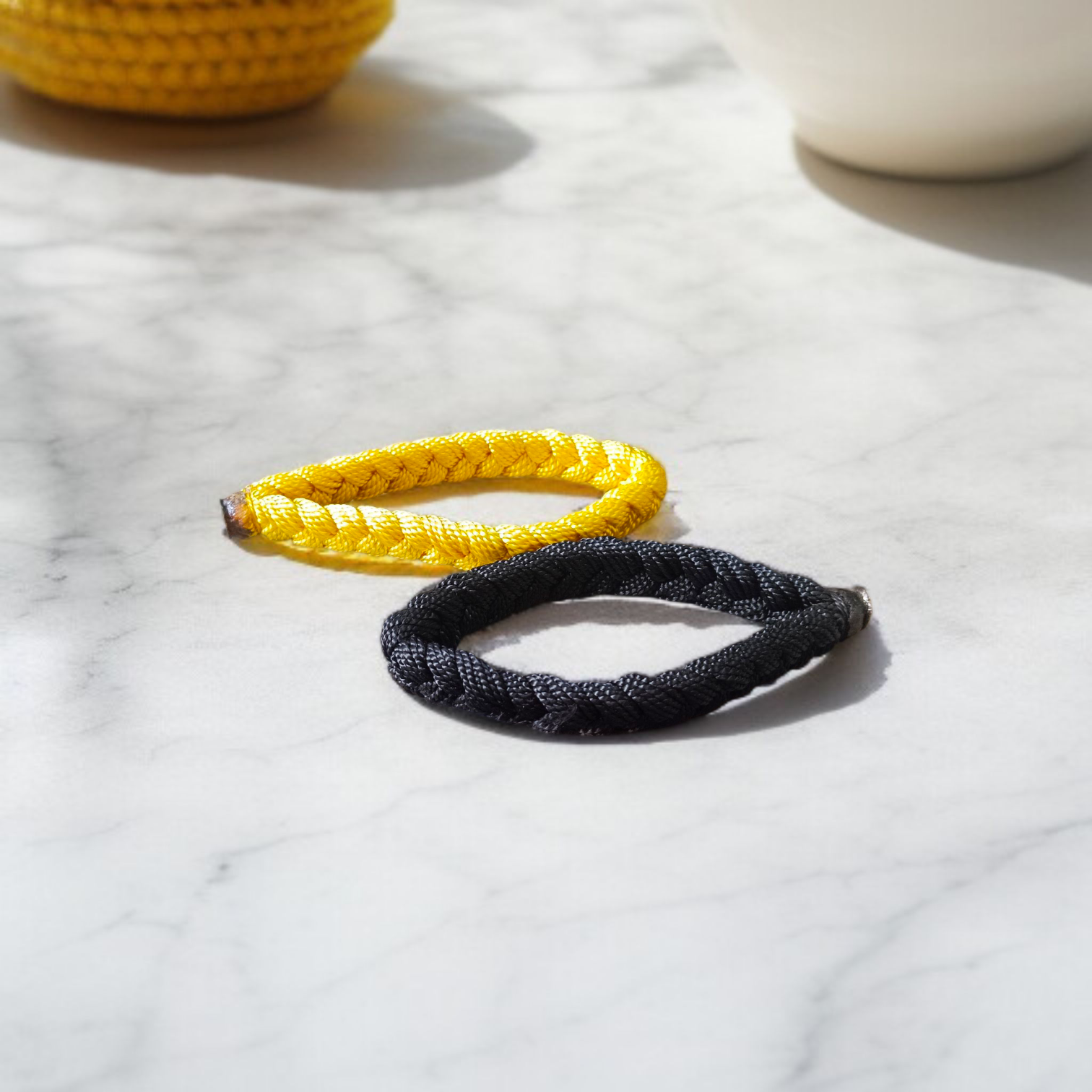 Handmade thread bracelet set of 4 in red, yellow, black, and multicolor for men and women, symbol of protection and spirituality by Gurupujan