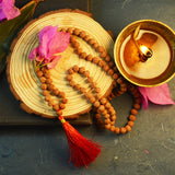 Image of 8 Mukhi Rudraksha mala with 27+1 and 108+1 bead variants displayed, showing lab certification badge and natural brown Rudraksha beads.