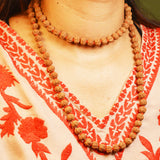 Image of 8 Mukhi Rudraksha mala with 27+1 and 108+1 bead variants displayed, showing lab certification badge and natural brown Rudraksha beads.