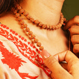 Image of 8 Mukhi Rudraksha mala with 27+1 and 108+1 bead variants displayed, showing lab certification badge and natural brown Rudraksha beads.