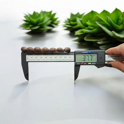 Image of Natural Kamal Gutta Bracelet made from 100% Original Lotus Seeds with Lab Certificate shown on a wrist for spiritual use