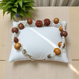 Image of Natural Rudraksha and Sandalwood Bracelet with lab-certified beads, used for energy balancing, protection, and spiritual well-being