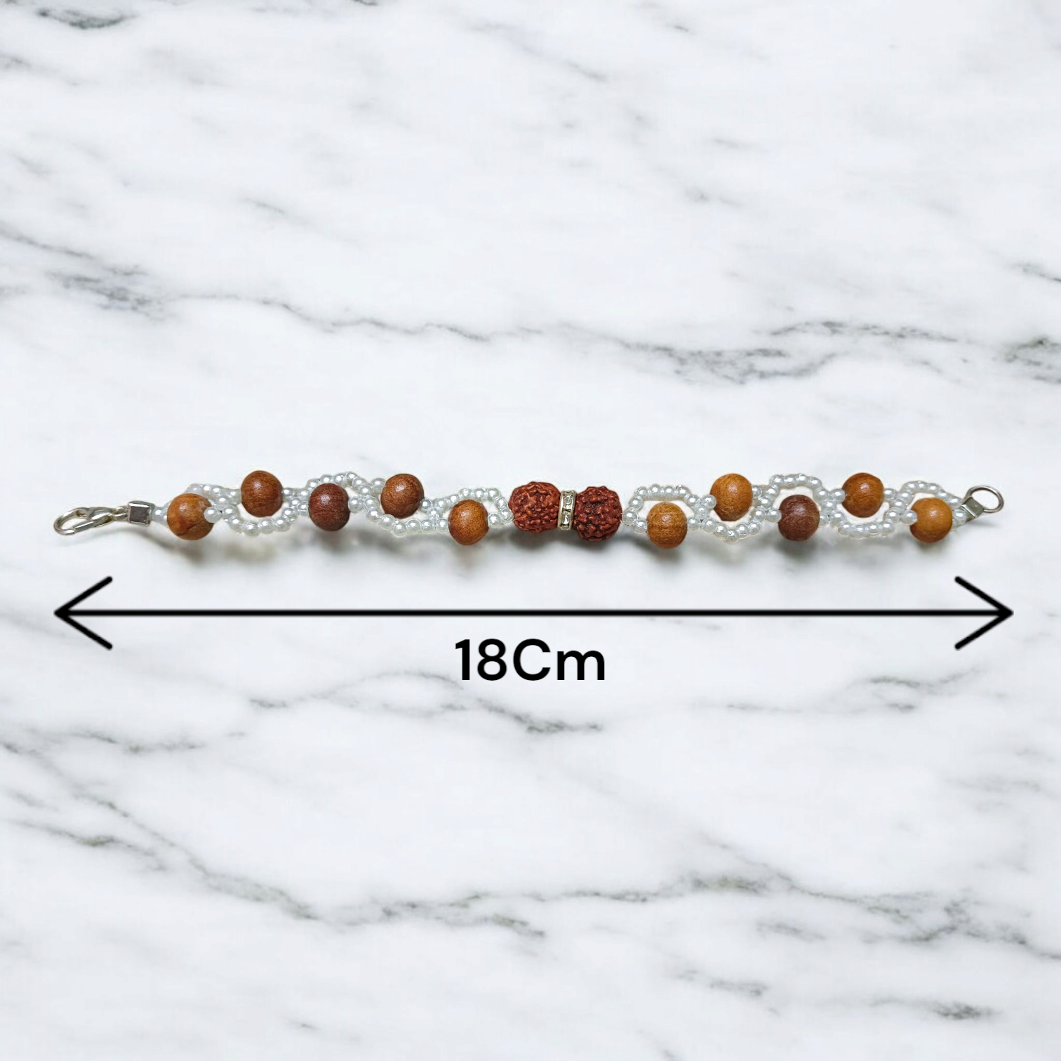 Image of Natural Rudraksha and Sandalwood Bracelet with lab-certified beads, used for energy balancing, protection, and spiritual well-being