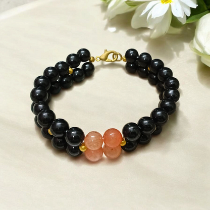 Image of a Lab Certified Hessonite and Black Agate Bracelet with 8mm beads, used for Rahu balancing, career growth, and spiritual stability