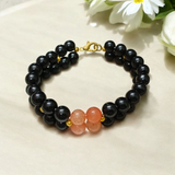 Image of a Lab Certified Hessonite and Black Agate Bracelet with 8mm beads, used for Rahu balancing, career growth, and spiritual stability