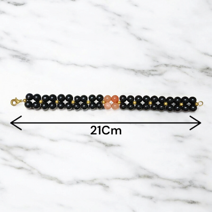 Image of a Lab Certified Hessonite and Black Agate Bracelet with 8mm beads, used for Rahu balancing, career growth, and spiritual stability