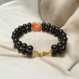 Image of a Lab Certified Hessonite and Black Agate Bracelet with 8mm beads, used for Rahu balancing, career growth, and spiritual stability