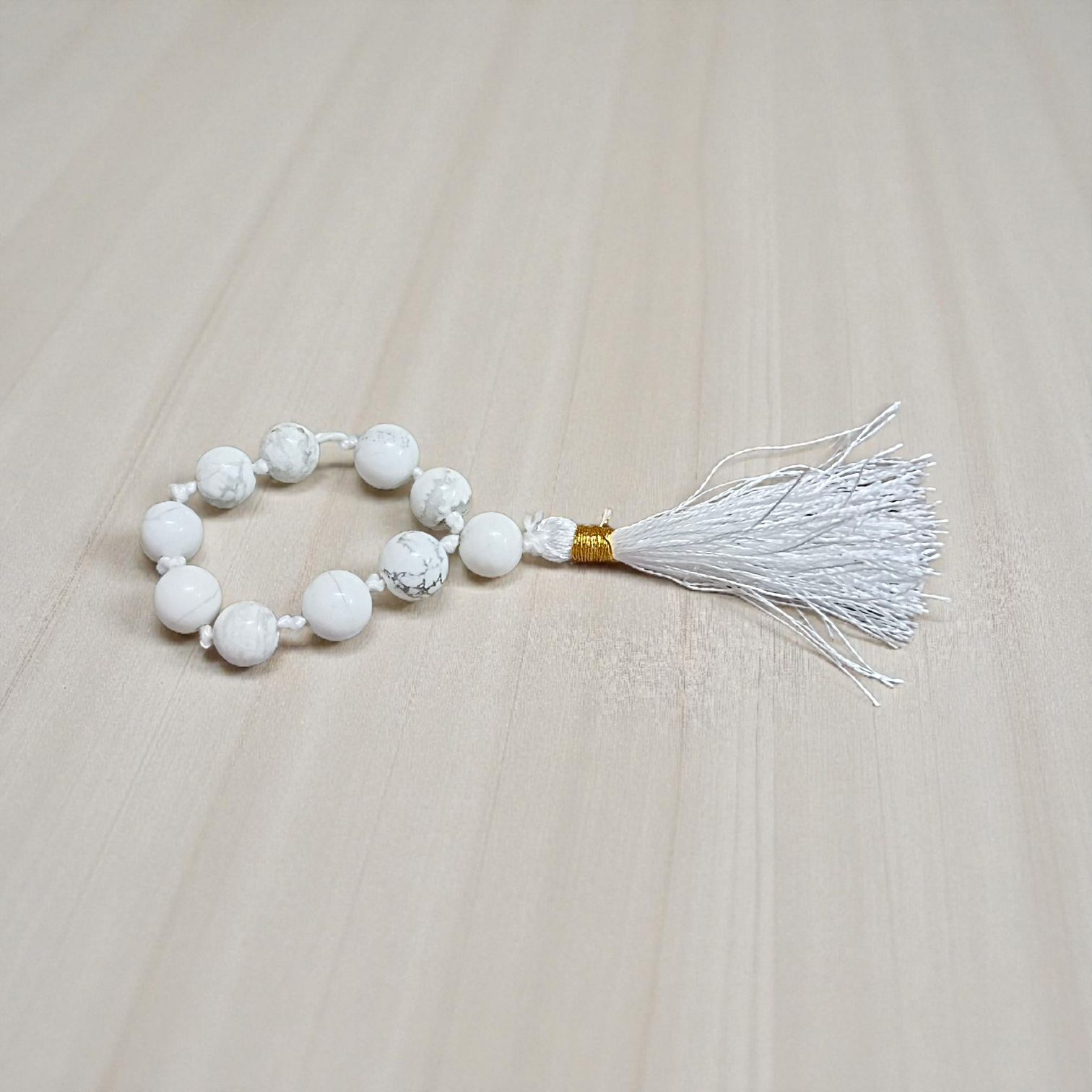 Image of a Natural Howlite Finger Mala with 9+1 lab-certified 8mm Howlite beads, ideal for meditation, peace, and emotional healing