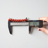 Image of a Natural Red Jasper Bracelet with 8mm polished beads, stretchable cord, and lab-certified gemstone design