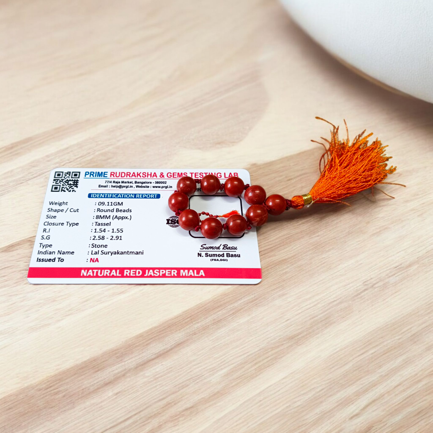 Image of a Natural Red Jasper Finger Mala with 8mm polished beads and a compact, portable design