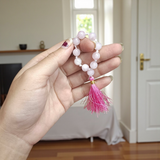 Image of a Natural Rose Quartz Finger Mala with 9+1 lab-certified 8mm beads, designed for meditation, peace, and emotional healing
