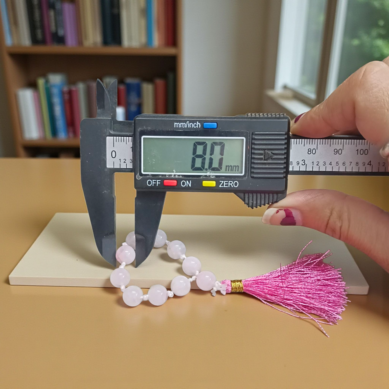 Image of a Natural Rose Quartz Finger Mala with 9+1 lab-certified 8mm beads, designed for meditation, peace, and emotional healing
