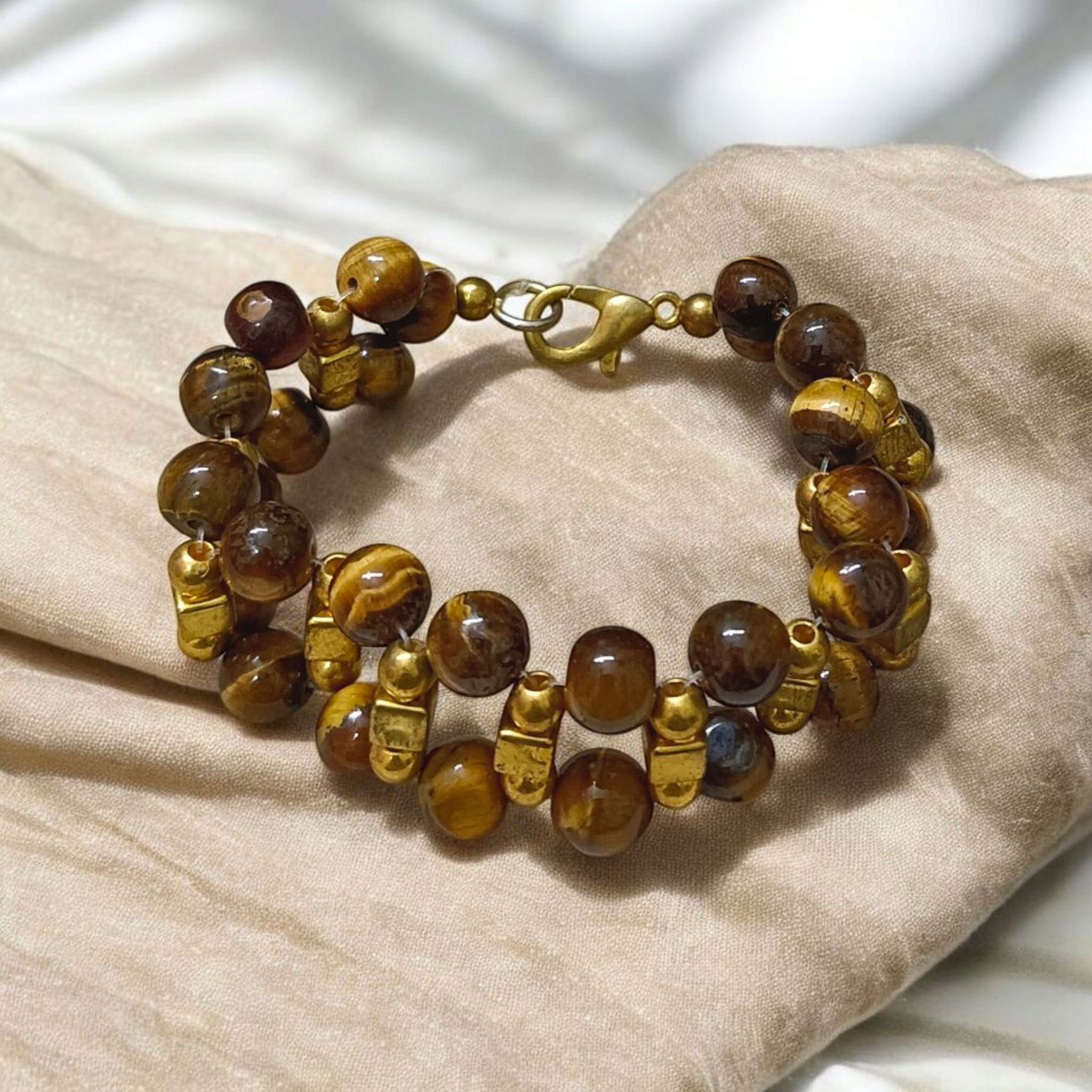 Image of a Natural Tiger Eye Bracelet made with polished 7mm lab-certified beads, designed for attracting good luck, wealth, and spiritual protection