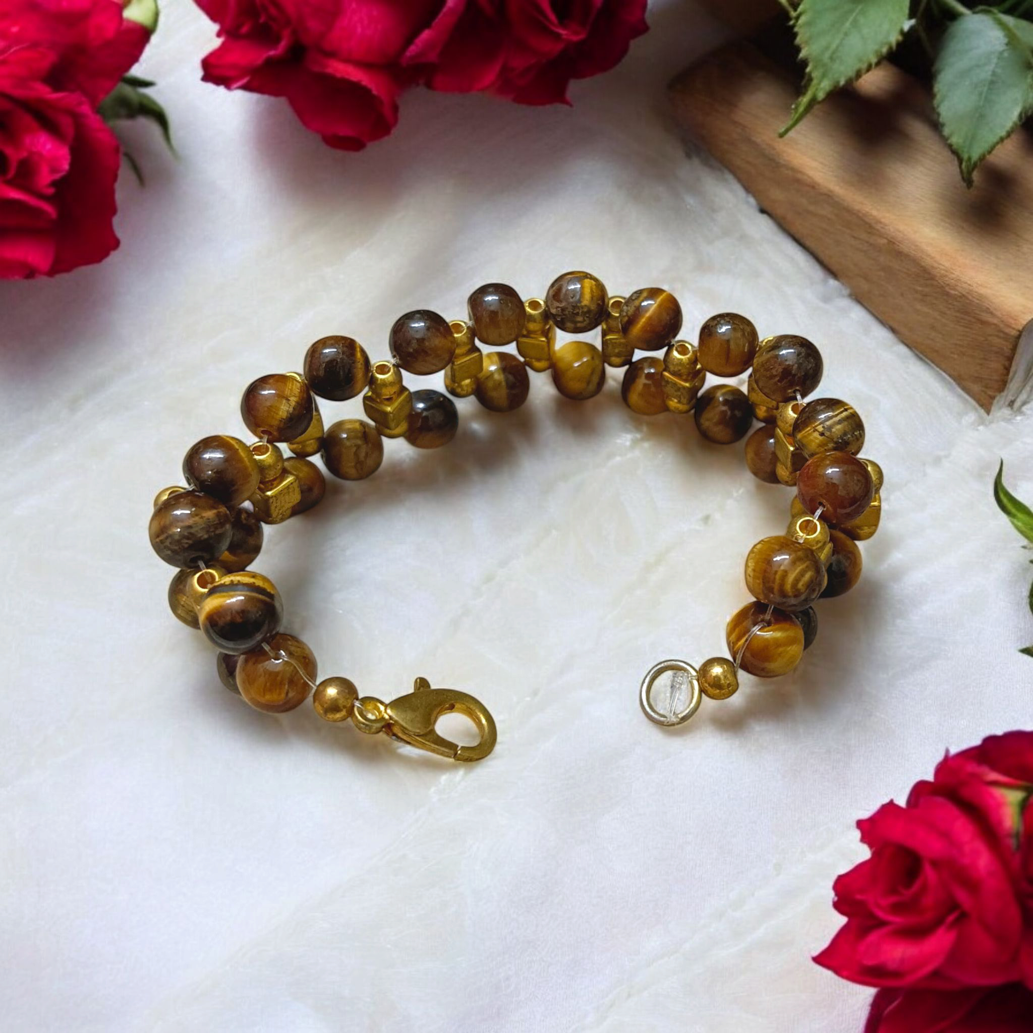 Image of a Natural Tiger Eye Bracelet made with polished 7mm lab-certified beads, designed for attracting good luck, wealth, and spiritual protection