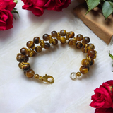 Image of a Natural Tiger Eye Bracelet made with polished 7mm lab-certified beads, designed for attracting good luck, wealth, and spiritual protection