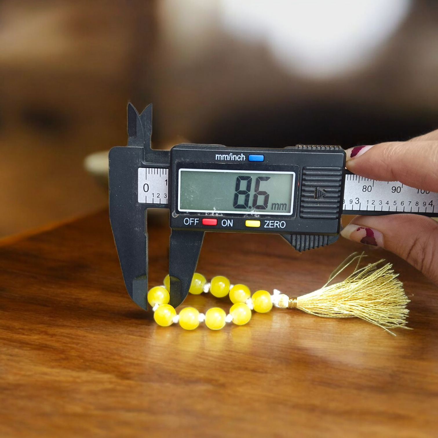 Image of a Natural Yellow Agate Finger Mala with 9+1 lab-certified yellow Hakik beads, beautifully handcrafted for meditation and healing