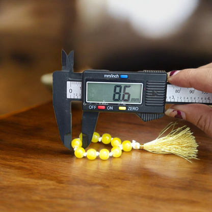 Image of a Natural Yellow Agate Finger Mala with 9+1 lab-certified yellow Hakik beads, beautifully handcrafted for meditation and healing