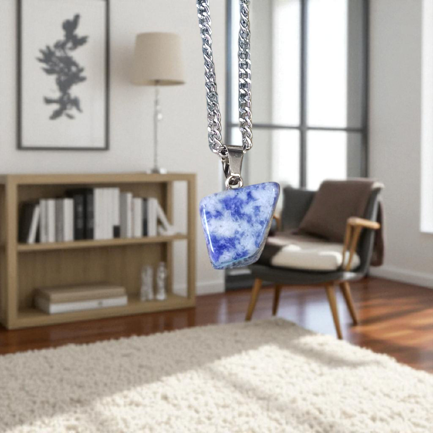 Image of a deep blue Lapis Lazuli Pendant with shimmering golden flecks, attached to a white metal chain – ideal for daily wear and spiritual benefits