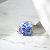 Image of a deep blue Lapis Lazuli Pendant with shimmering golden flecks, attached to a white metal chain – ideal for daily wear and spiritual benefits