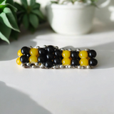 Image of a lab-certified Black Agate and Yellow Agate Bracelet with 8mm beads, designed for emotional healing, mental clarity, and daily wear
