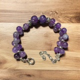 Image of a lab-certified Natural Amethyst Bracelet with polished 8mm beads, designed for emotional healing, sleep improvement, and spiritual protection
