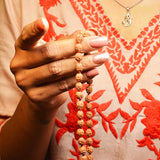 Image of authentic 4 Mukhi Rudraksha Mala in 27+1 and 108+1 bead variants, lab-certified, used for creativity and Guru Pujan.