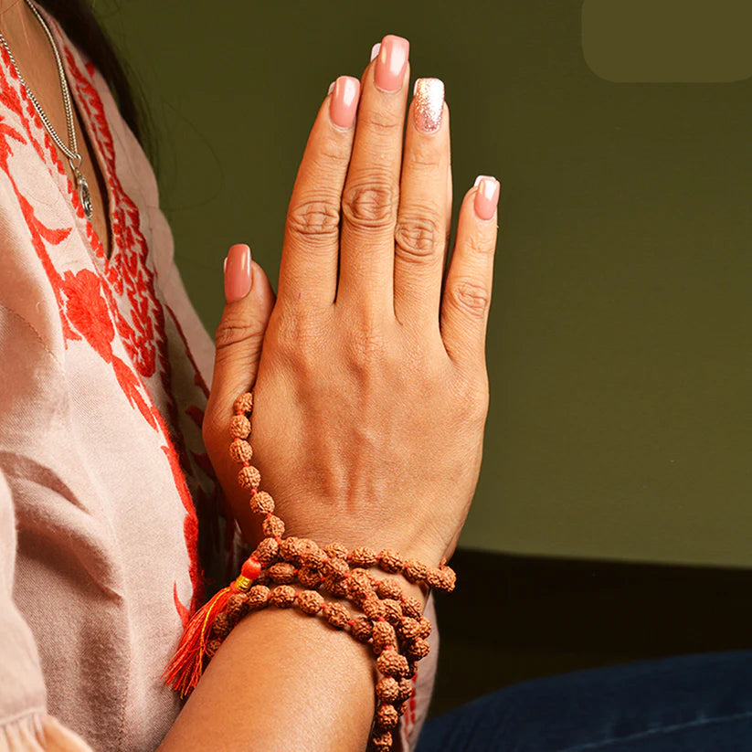 Image of authentic 4 Mukhi Rudraksha Mala in 27+1 and 108+1 bead variants, lab-certified, used for creativity and Guru Pujan.