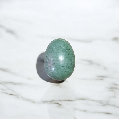 Image of handcrafted greenish black Shivling stone ideal for Tulsi plant, temple, or garden use