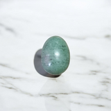 Image of handcrafted greenish black Shivling stone ideal for Tulsi plant, temple, or garden use
