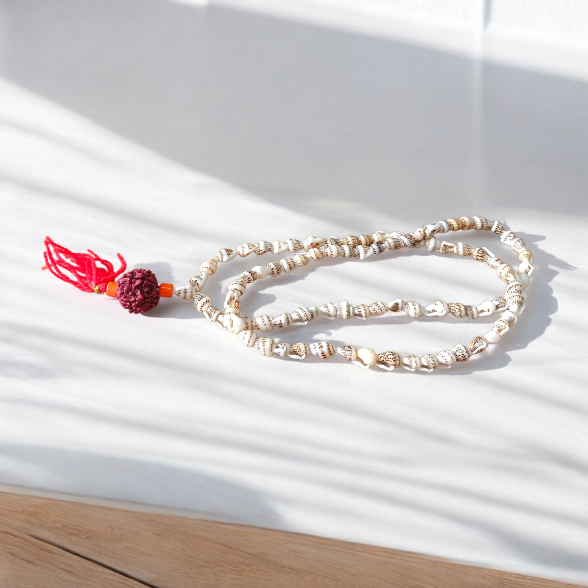 Image of lab-certified Shankh Mala made from natural conch shells, ideal for chanting and spiritual practices