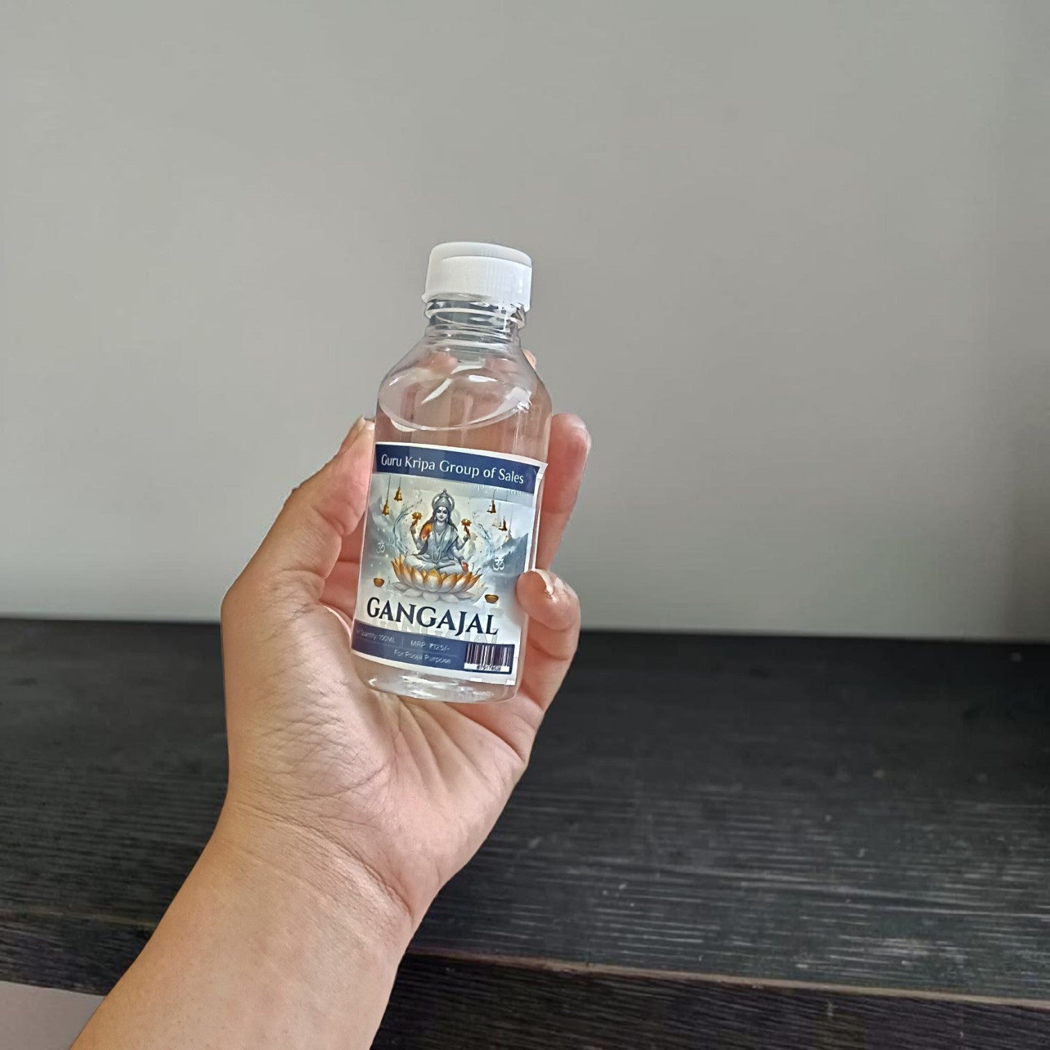 Image of two sealed 100g bottles of Pure Gangajal Holy Water, ideal for puja and spiritual rituals