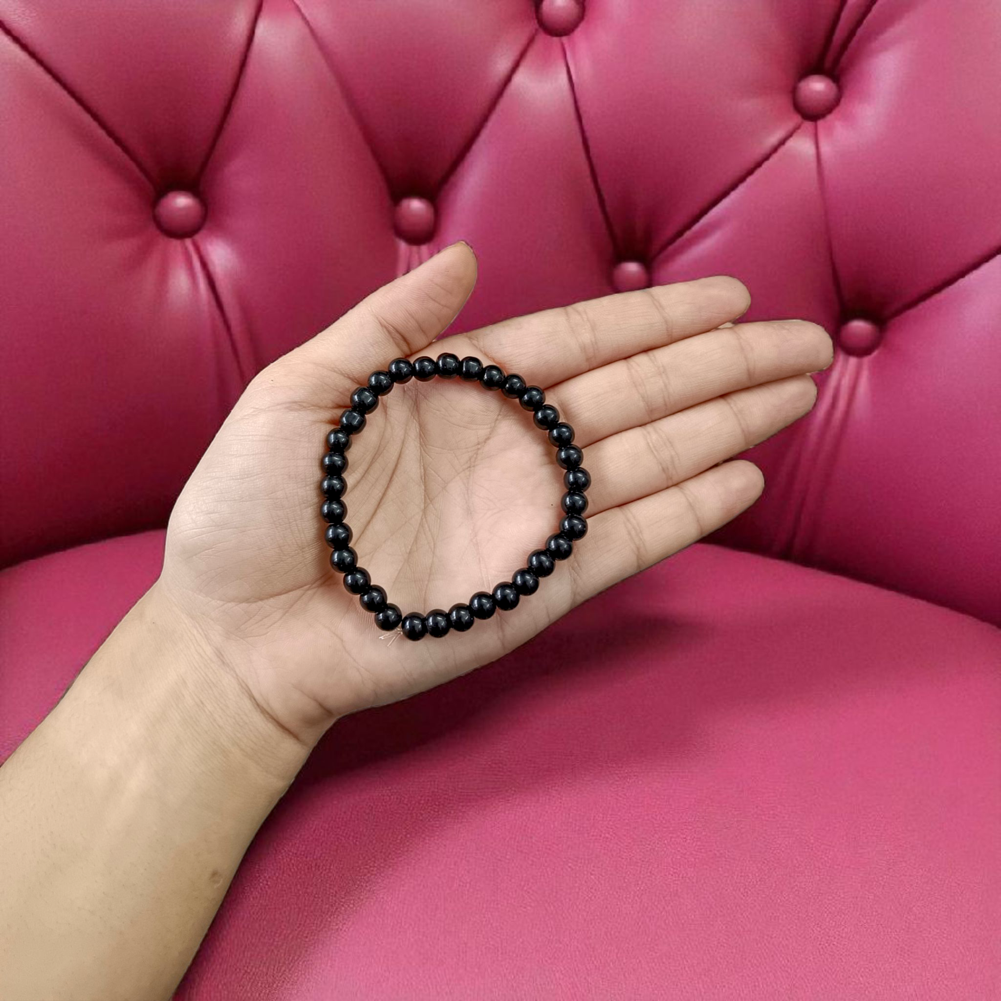 Image showing a premium Natural Black Agate Bracelet made with 6mm smooth round beads on a stretchable elastic band