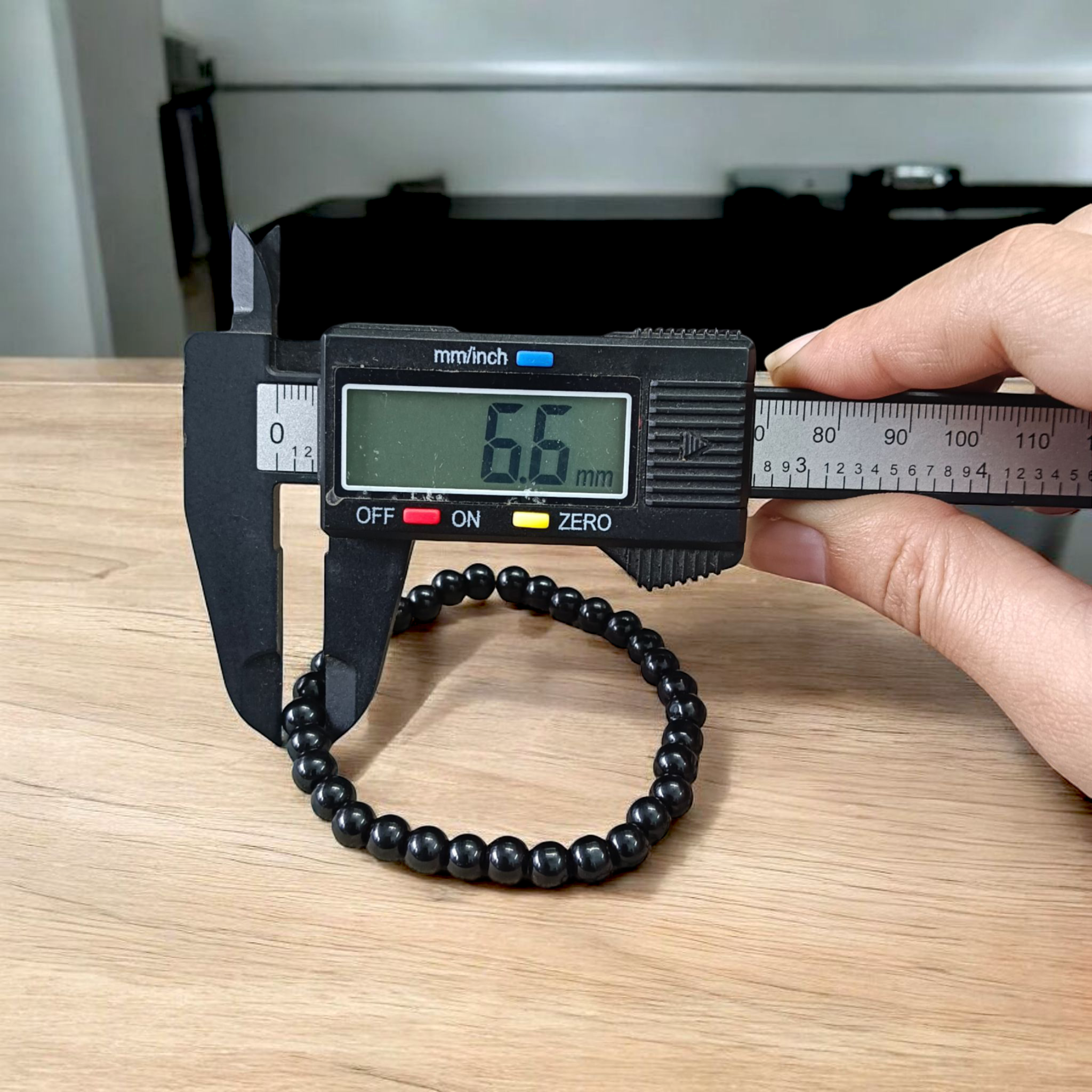 Image showing a premium Natural Black Agate Bracelet made with 6mm smooth round beads on a stretchable elastic band