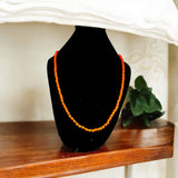 Image showing an energized Orange Monga Mala with 108+1 coral beads, ideal for Mars-related spiritual remedies