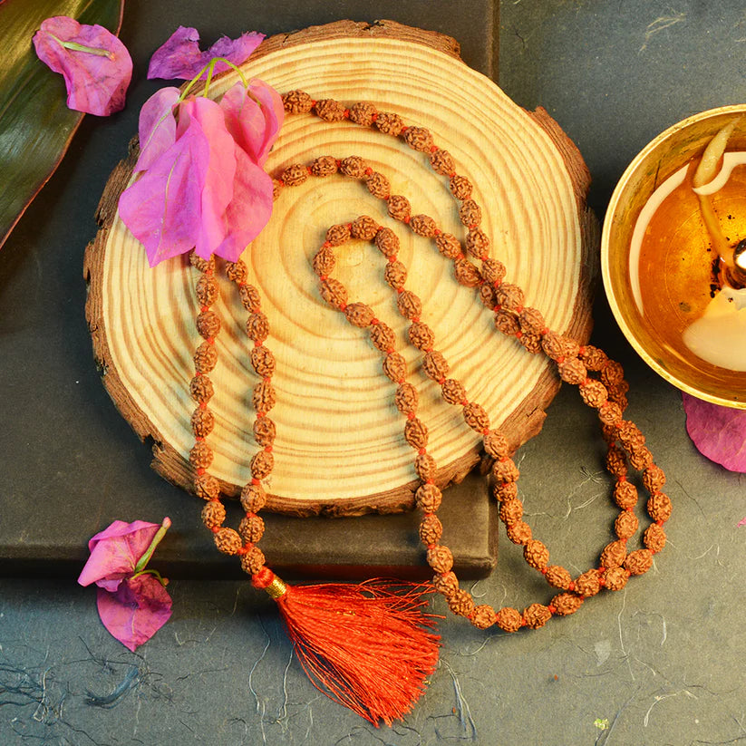 Lab-certified 3 Mukhi Rudraksha Mala for stress and anxiety relief, available in 27+1 and 108+1 bead variants, by Gurupujan.