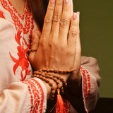 Lab-certified 3 Mukhi Rudraksha Mala for stress and anxiety relief, available in 27+1 and 108+1 bead variants, by Gurupujan